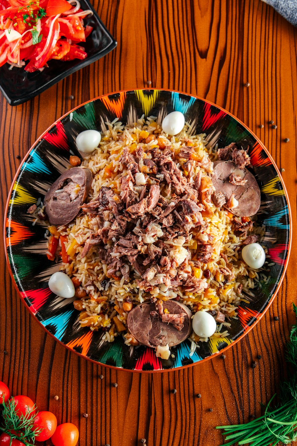 a colorful plate of food on a wooden table