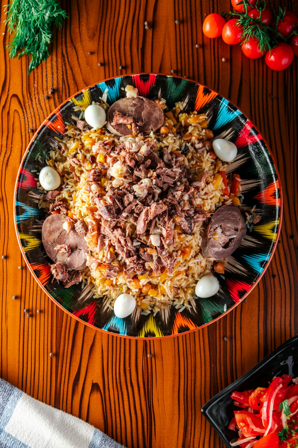 a colorful plate of food on a wooden table