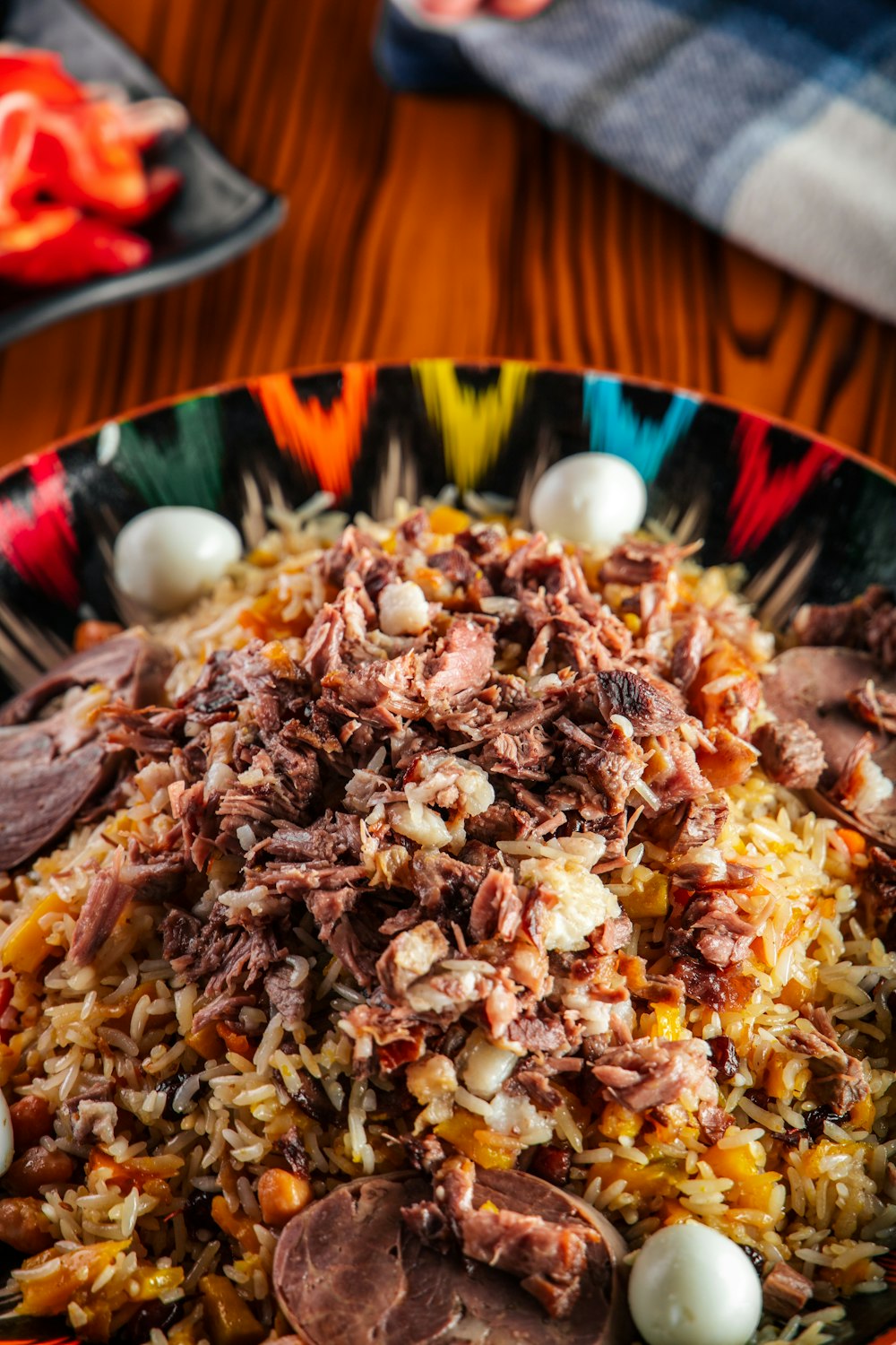 a plate of food with meat and rice on a table
