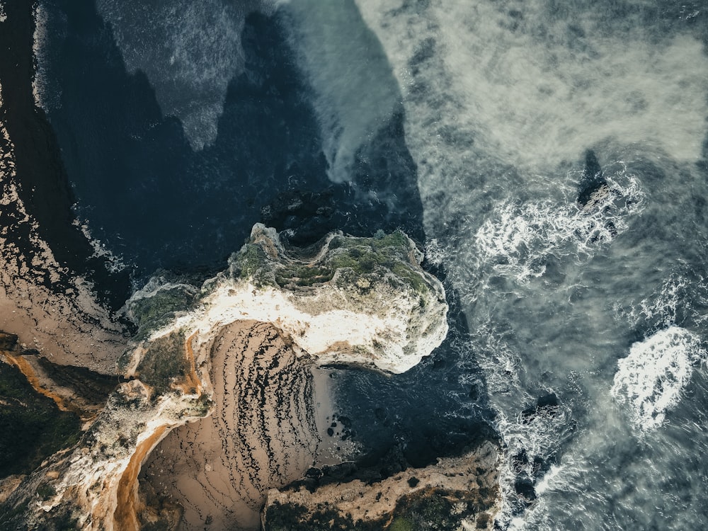 an aerial view of the ocean and land