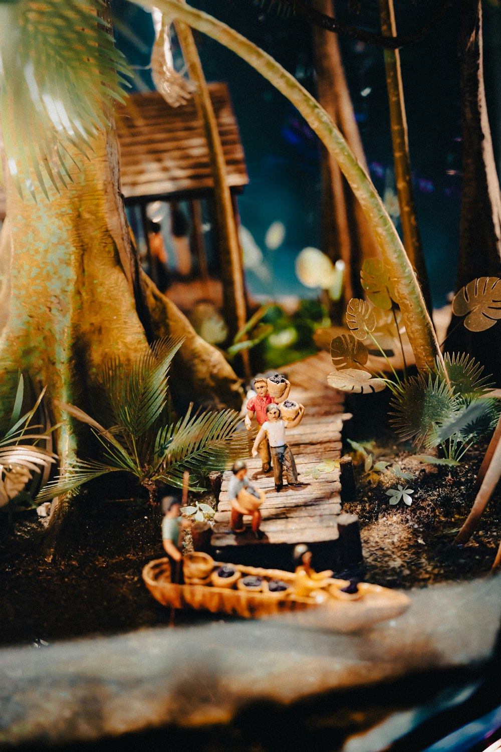 a toy scene of a man on a wooden bridge