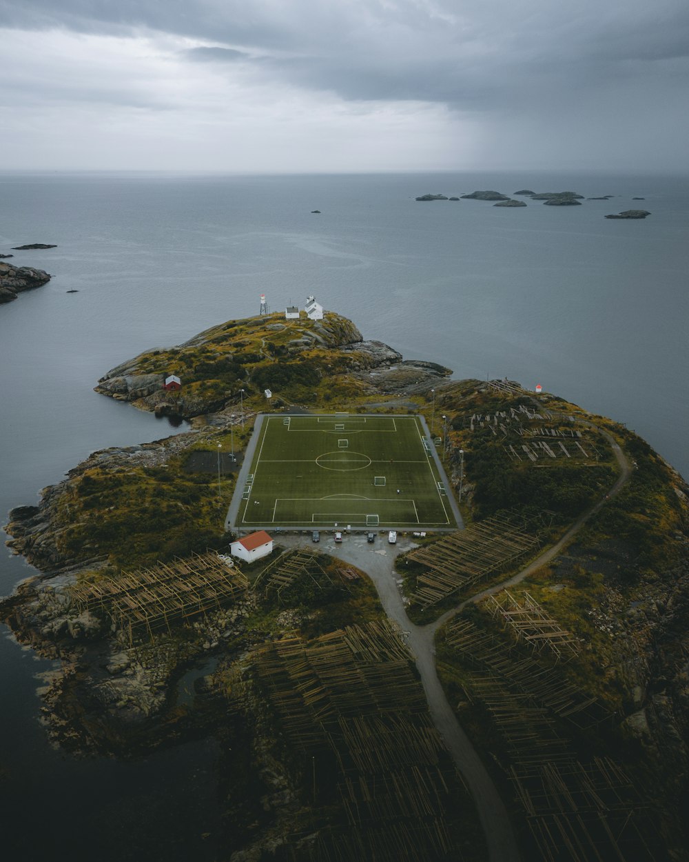 an aerial view of a soccer field on an island