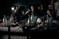 A group of friends celebrating a win at a gaming table.