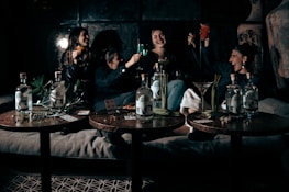 Happy group of friends celebrating a winning bet together.