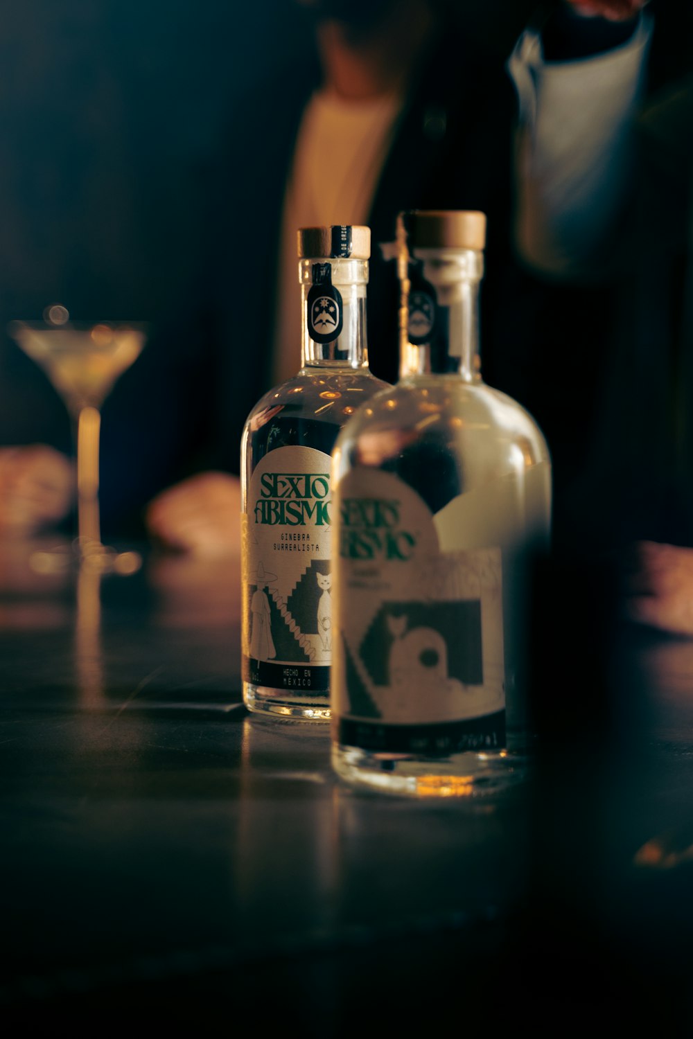 a couple of bottles of liquor sitting on top of a table