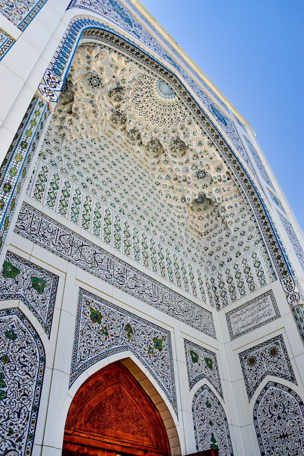 a large white building with a wooden door