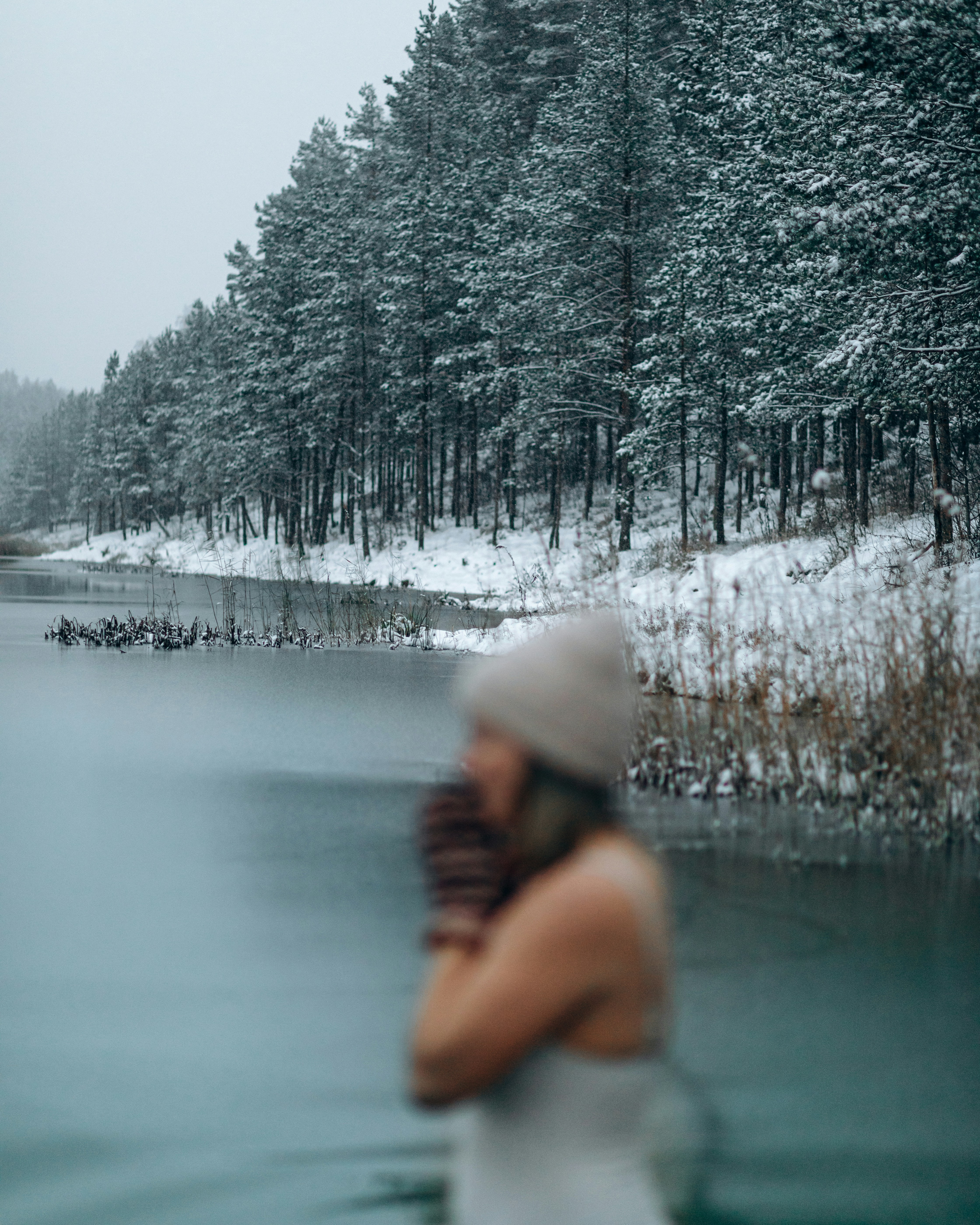 A woman in a white dress standing in a body of water photo – Free Woman ...
