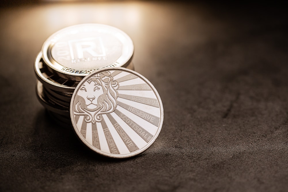 a stack of coins sitting on top of a table