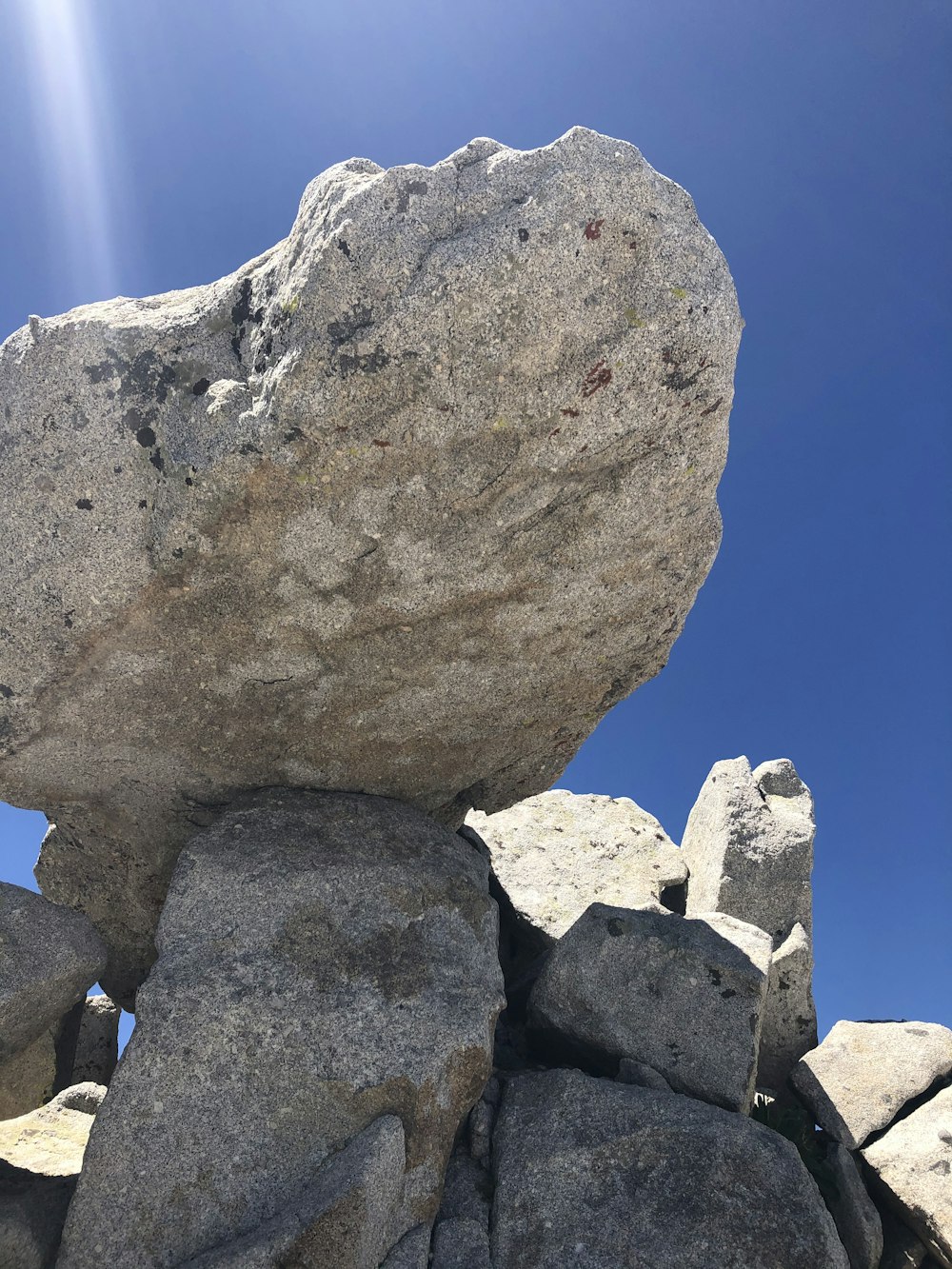 a large rock sitting on top of a pile of rocks