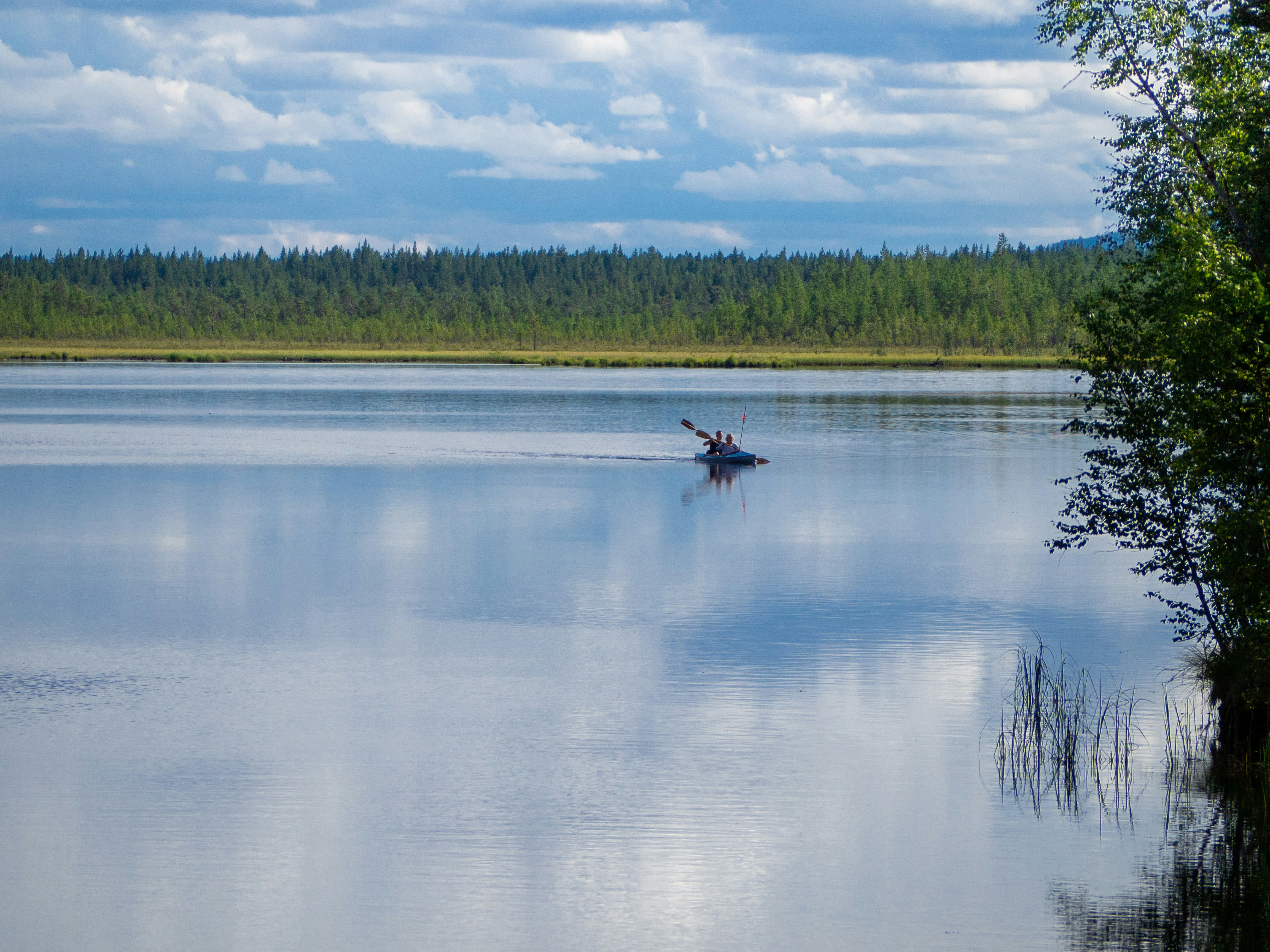 a person in a boat on a large body of water