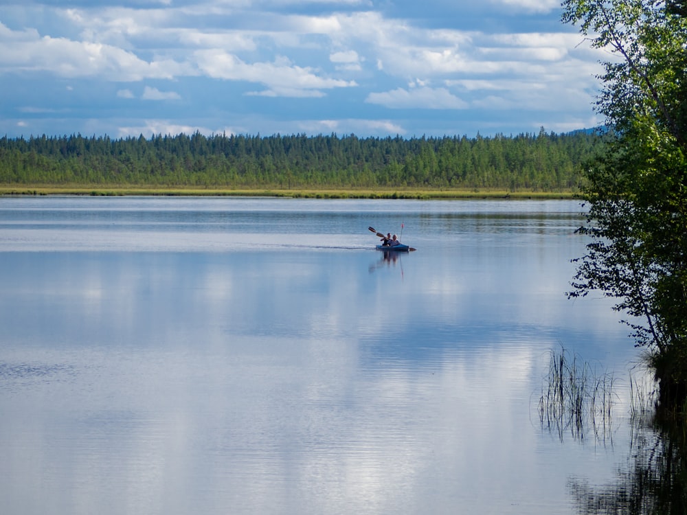 a person in a boat on a large body of water