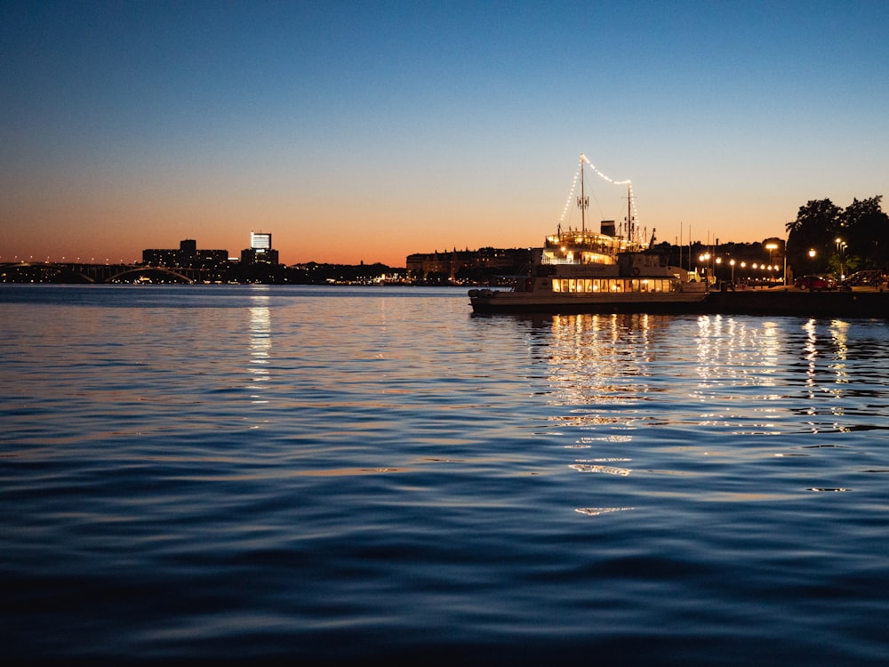 a large boat floating on top of a body of water