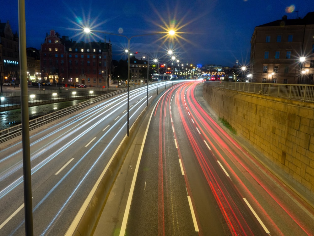 a city street filled with lots of traffic at night