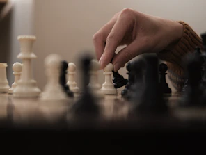a person is playing a game of chess