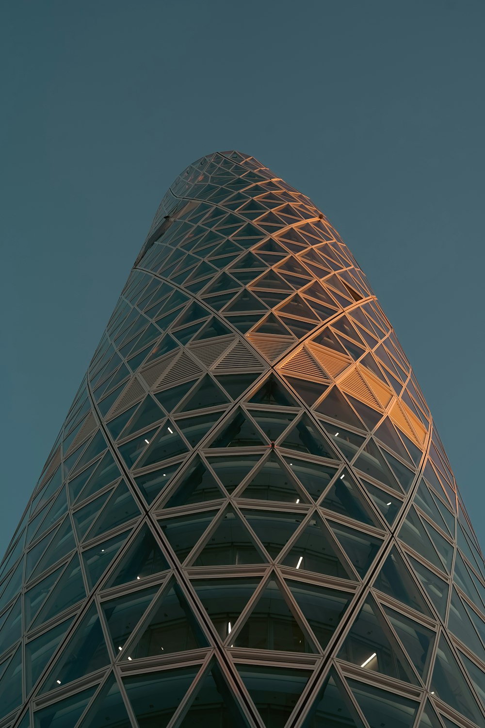 a very tall building with a sky background