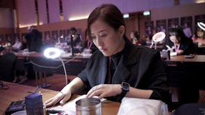 Economic empowerment workshop showing women learning skills around a table with bright natural light