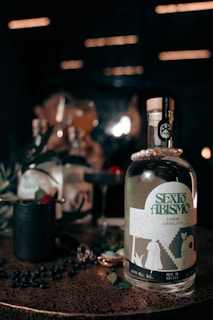 A vibrant photo showcasing a bottle of anis carteluo against a scenic backdrop of southern Brazil.