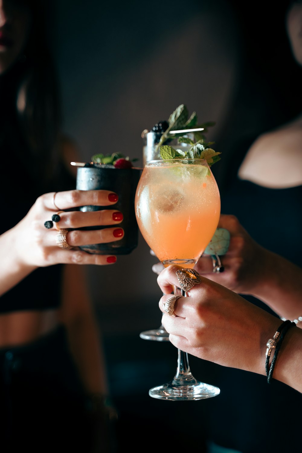 a close up of a person holding a drink