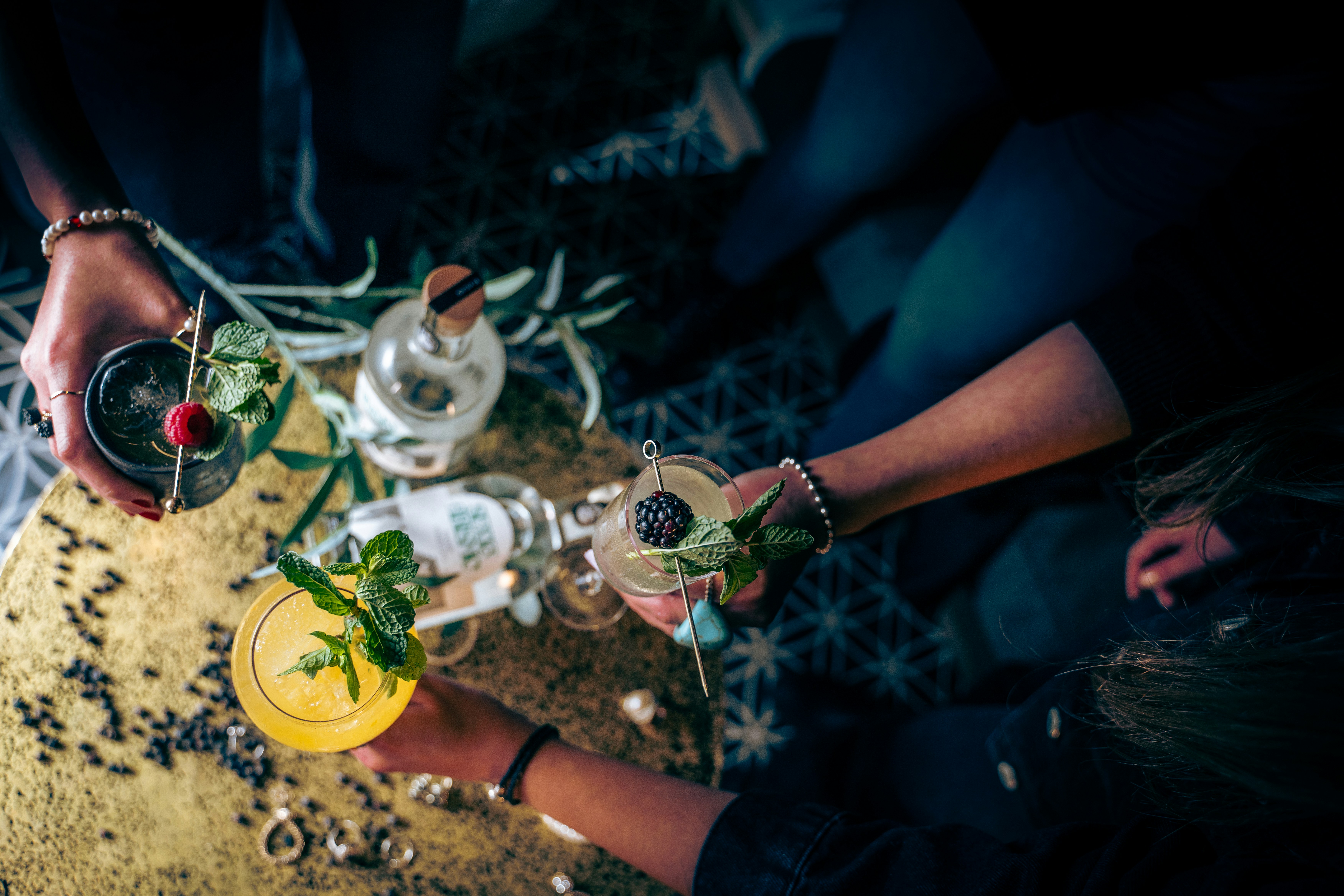 a group of people holding glasses filled with drinks