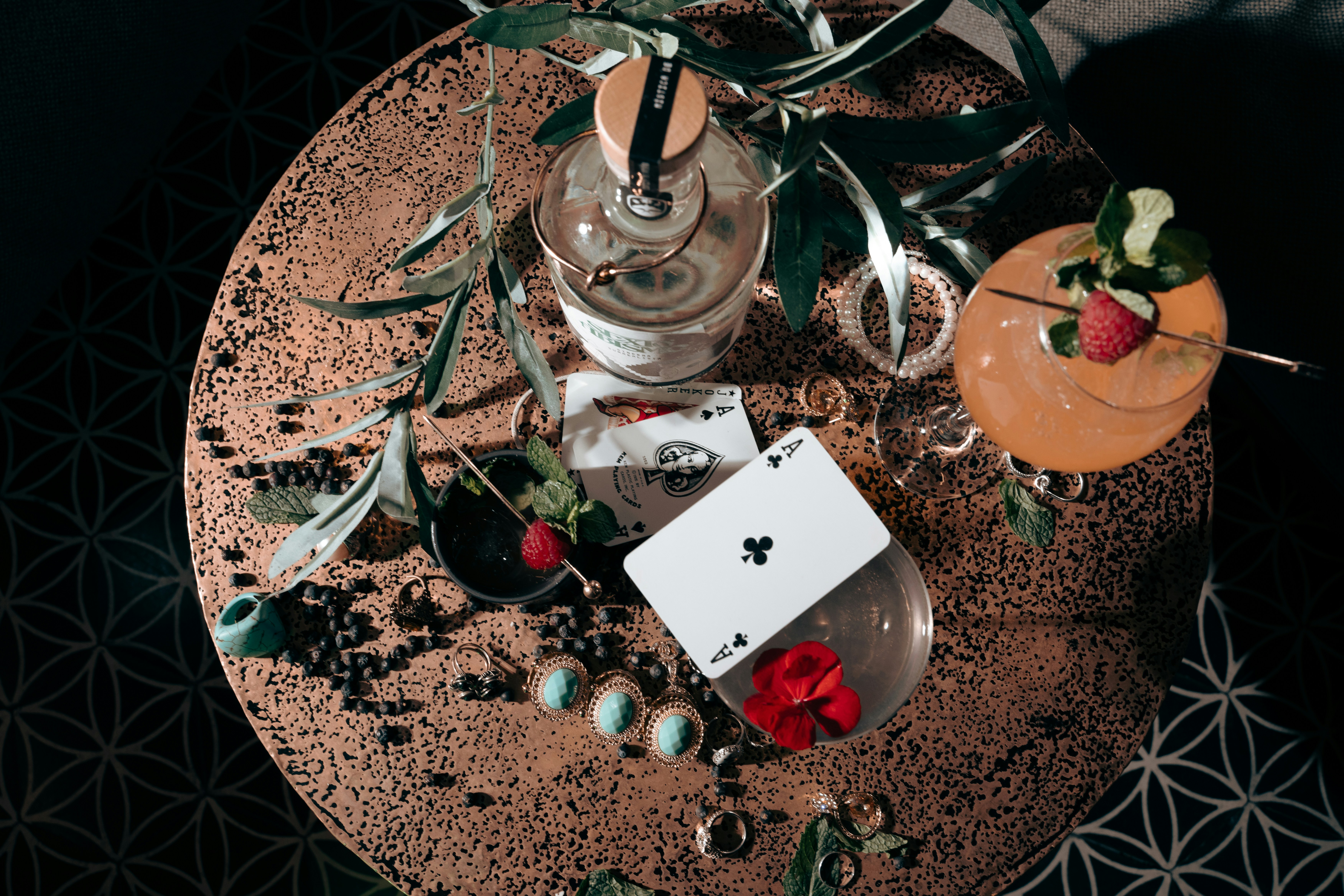 a table topped with a card and a vase filled with flowers
