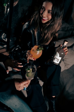 Charming hostess welcoming guests with a bright smile in a stylish bar setting.