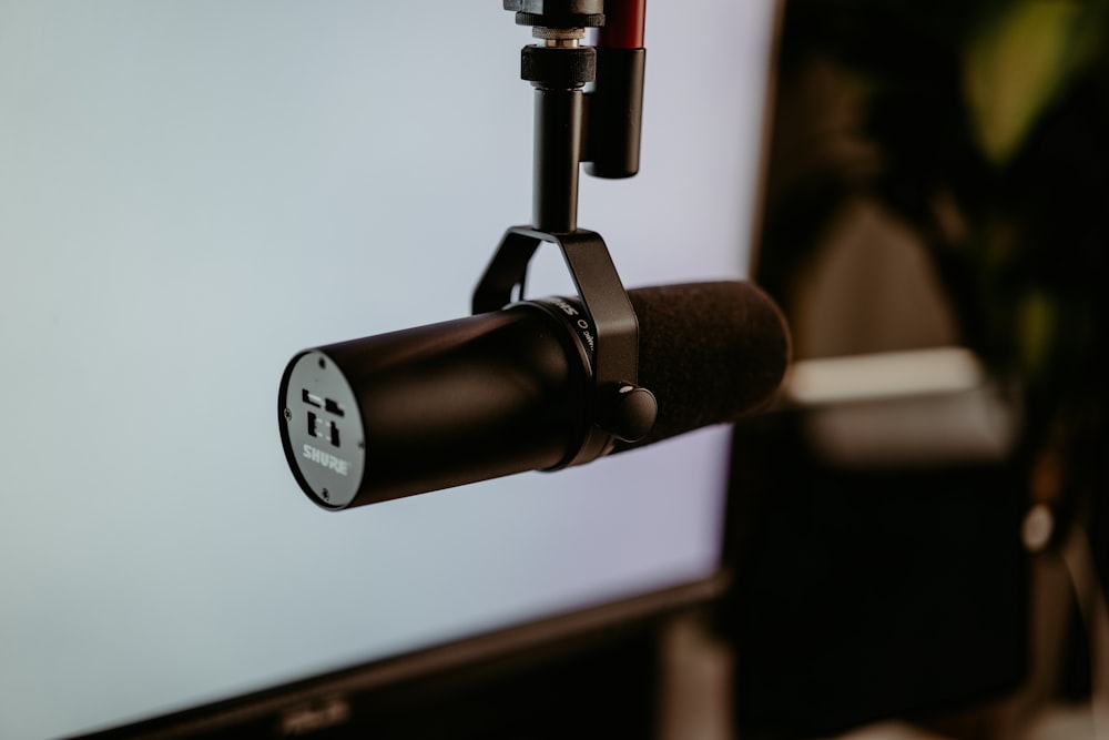 a close up of a microphone and a monitor