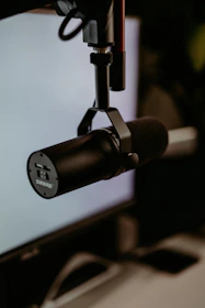 A sleek microphone on a stand ready for a professional voice recording session.