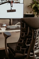 A modern office chair with ergonomic design in a bright workspace.