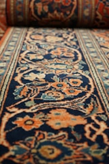 a carpet with a blue and orange design on it