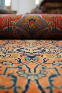 a close up of a rug with a pattern on it