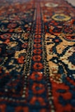 a close up of a rug with a very colorful design