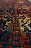 a close up of a rug with a very colorful design