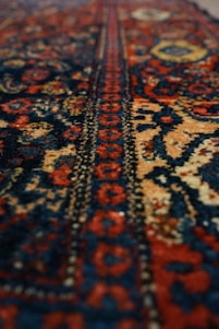 a close up of a rug with a very colorful design