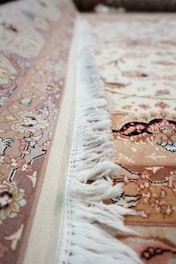 a close up of a rug with fringes on it