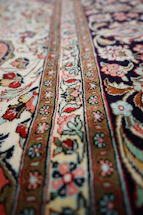 a close up of a rug with a pattern on it