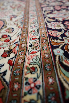 a close up of a rug with a pattern on it