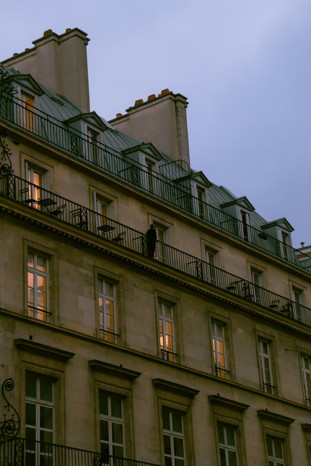 a tall building with lots of windows and balconies