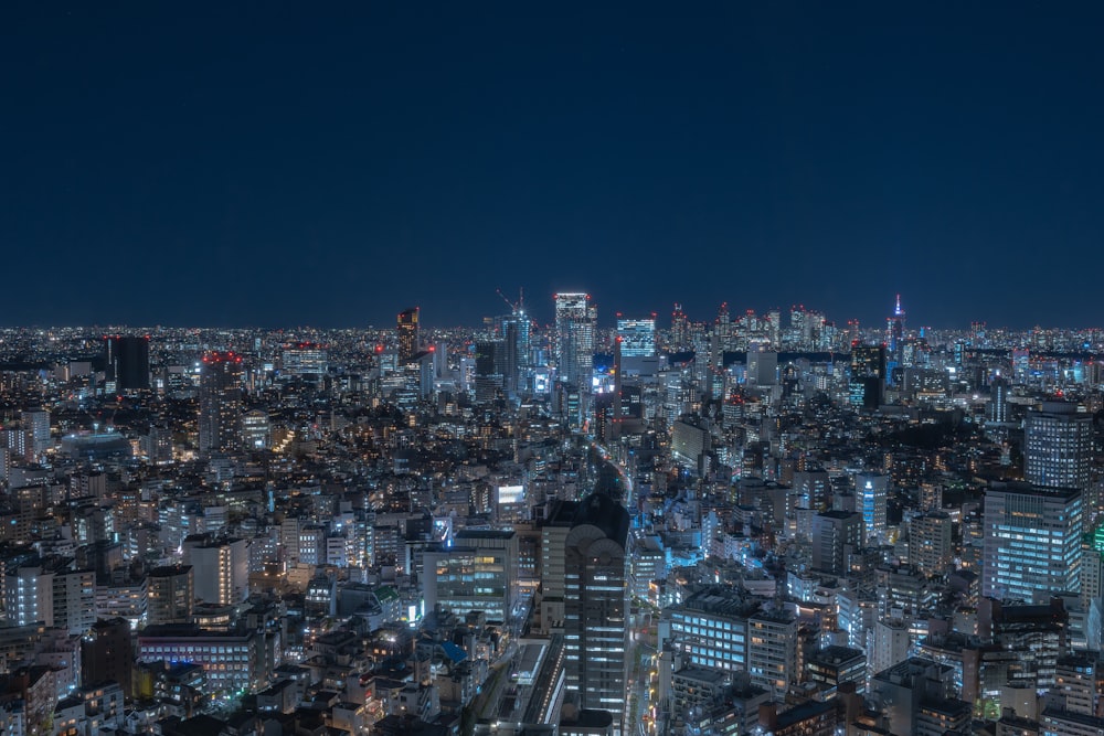 a view of a city at night from the top of a building