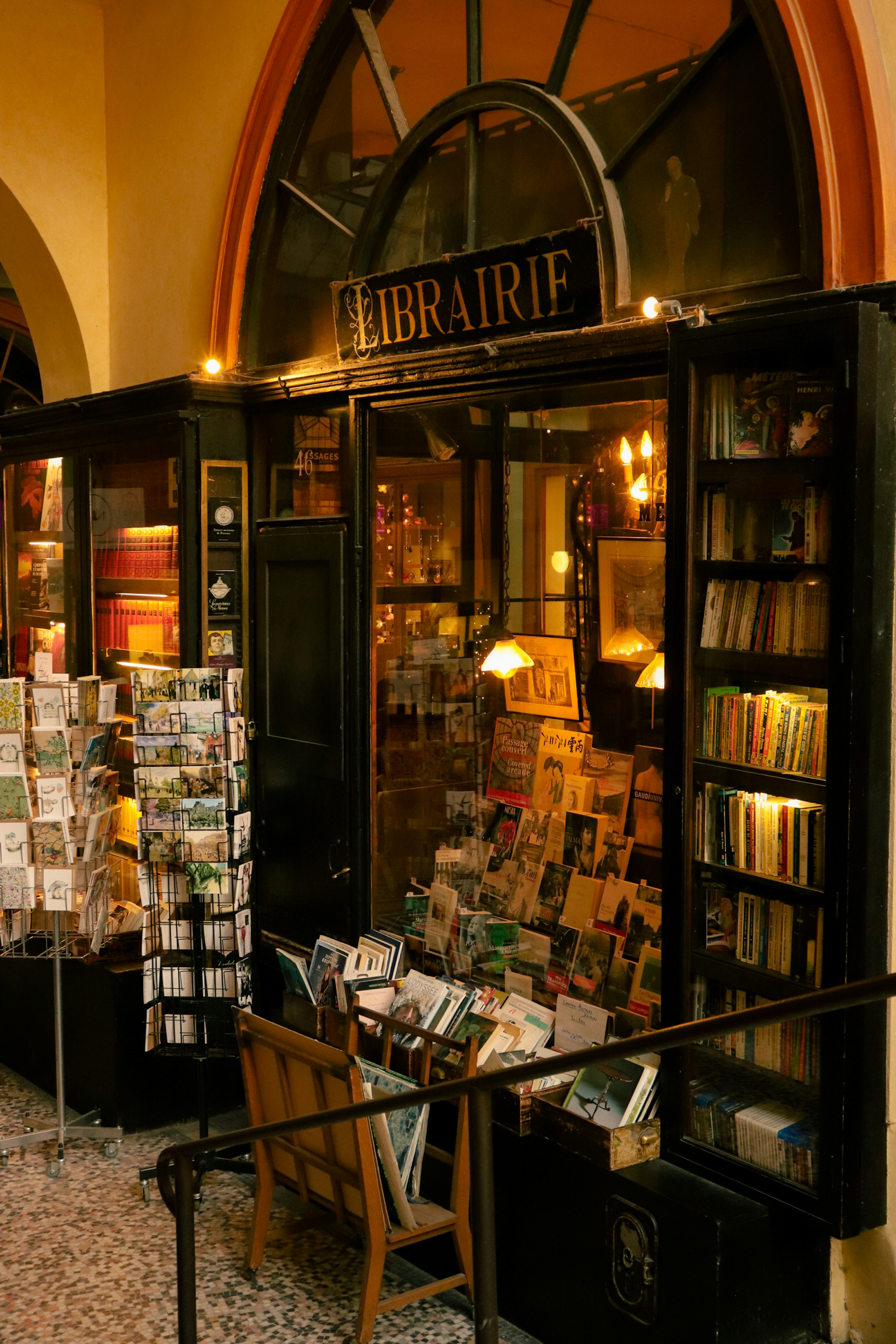 A bookstore with a table and chairs in front of it photo Free Classic