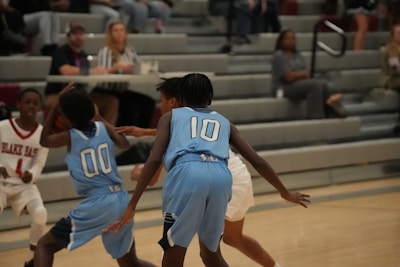 College basketball squad in sleek apace athletics shorts and jerseys during an intense game moment.
