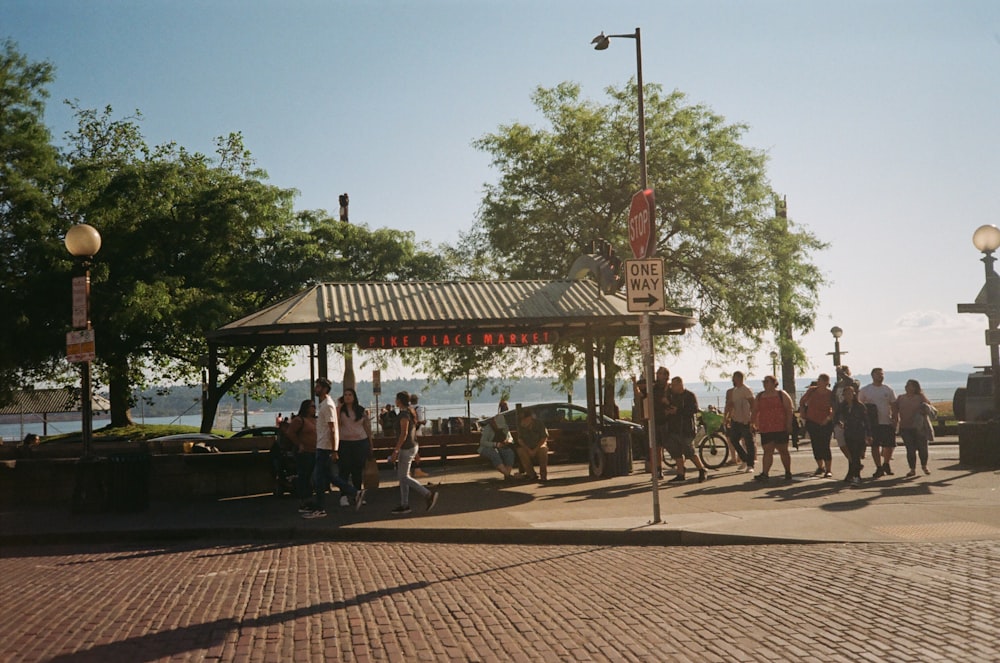 a group of people standing around a gazebo