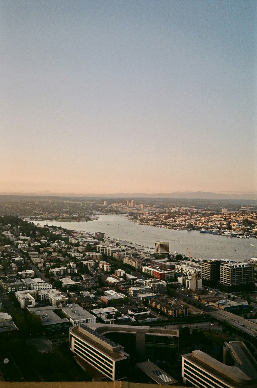 an aerial view of a city and a body of water