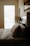 A cozy bedroom scene featuring a soft pillow on a neatly made bed.