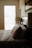 A cozy bedroom scene featuring a soft pillow on a neatly made bed.