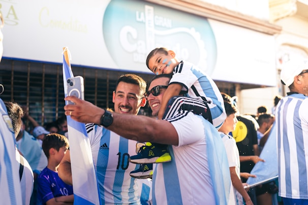 A group of friends celebrating with a football.