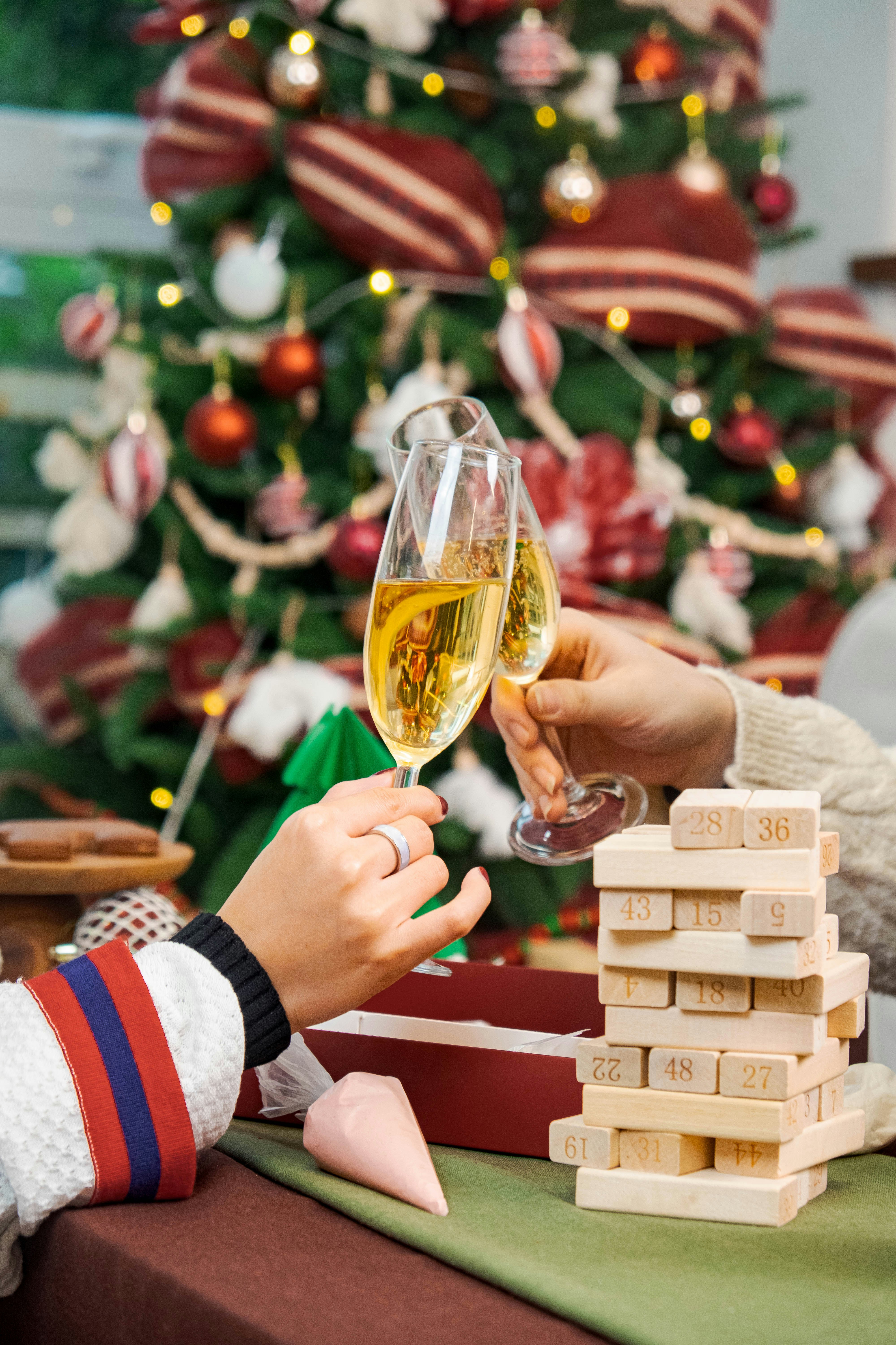 a couple of people that are holding wine glasses