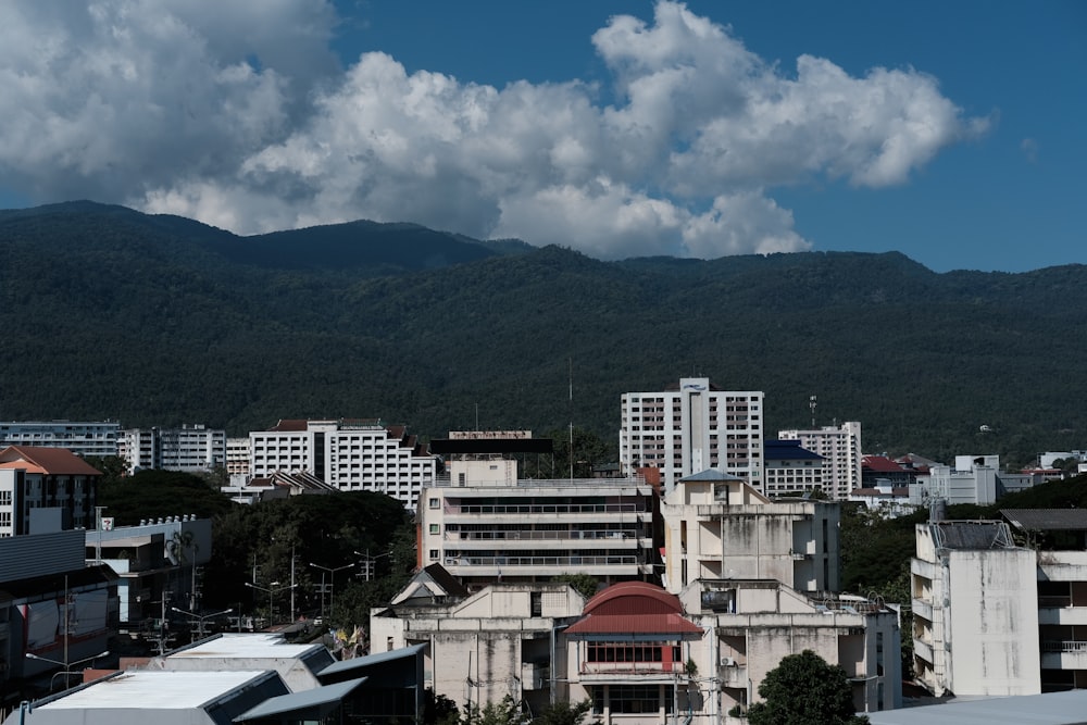 a view of a city with mountains in the background