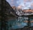 A stunning view of the Swiss Alps reflecting in a serene lake at sunset.