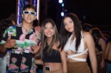 A group of friends showcasing vibrant party wear outfits.