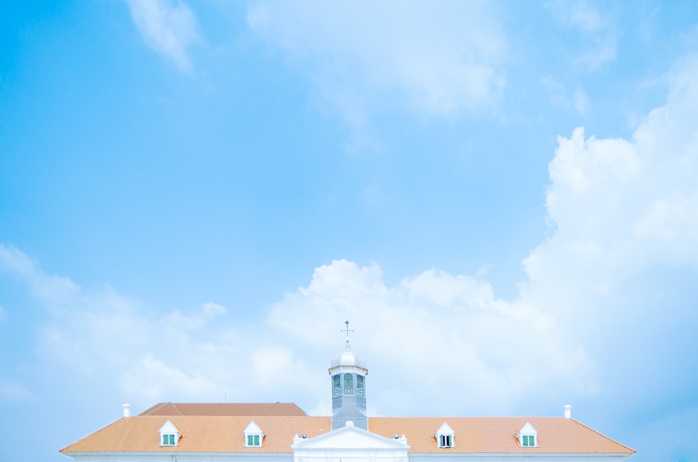 a large white building with a clock tower